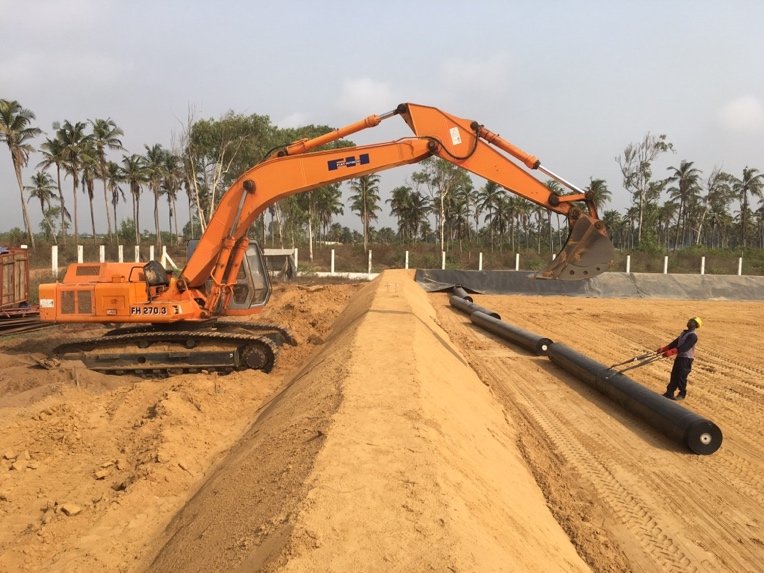 Geomembrane panels being deployed on a prepared subgrade